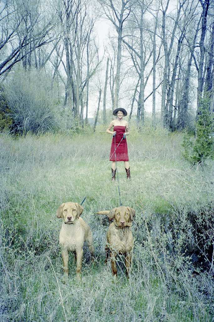 Birdie taming puppies by Clara DeWeese